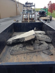 broken asphalt in Blue Box Rental dumpster in Hagerstown MD